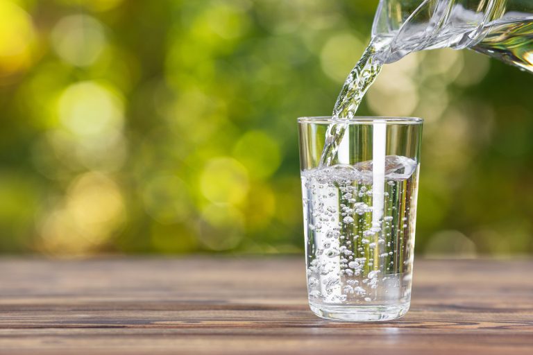 glass of water from a whole house water filtration system
