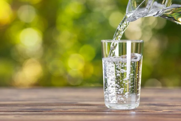 glass of water from a whole house water filtration system